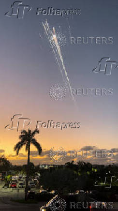 Orange balls of light fly across the sky as debris from a SpaceX rocket launched in Texas is spotted over Turks and Caicos Islands