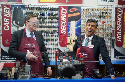 British Prime Minister Rishi Sunak visits a branch of Timpson, in London