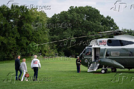 U.S. President Joe Biden wears the team USA Olympics jacket as he departs from the South Lawn of the White House