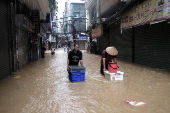 Red River overflows causing severe flooding in Hanoi following Typhoon Yagi