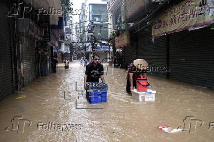 Red River overflows causing severe flooding in Hanoi following Typhoon Yagi