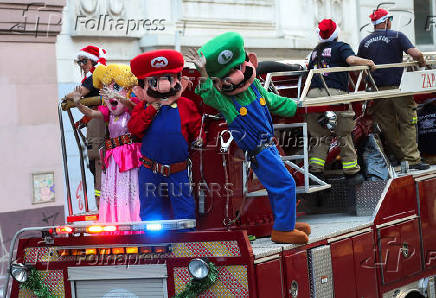 Firefighters dressed as Super Mario characters greet people during Christmas season celebrations in Valparaiso