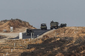 Israeli military vehicles operate in the Gaza Strip, amid the ongoing conflict between Israel and Hamas, as seen from southern Israel