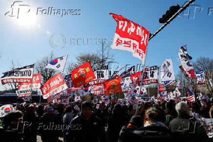 Impeached South Korean President Yoon Suk Yeol's supporters rally near the Corruption Investigation Office for High-ranking Officials, following his arrest, in Gwacheon