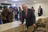 Colombia's former president Alvaro Uribe reacts during a news conference in Bogota