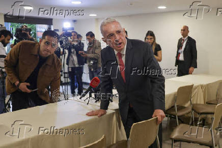 Colombia's former president Alvaro Uribe reacts during a news conference in Bogota