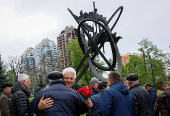 People attend a ceremony marking the anniversary of the Chornobyl nuclear disaster in Kyiv