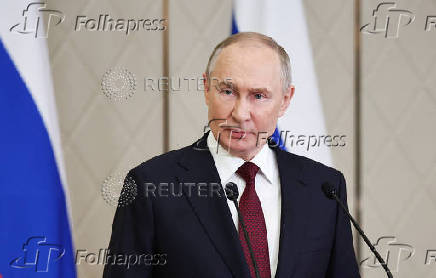 Russian President Putin attends a press conference in Astana