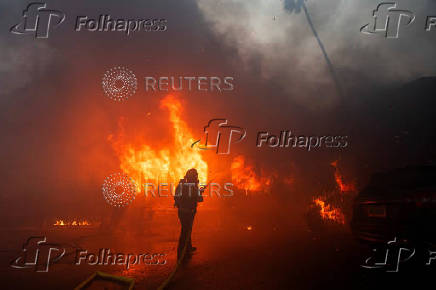 Palisades Fire burns during a windstorm on the west side of Los Angeles