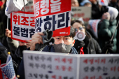 Pro-Yoon protesters participate in a rally outside a court, in Seoul