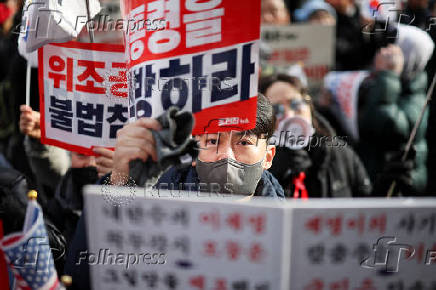 Pro-Yoon protesters participate in a rally outside a court, in Seoul