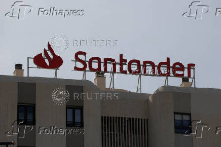 The logo of Santander is seen on the roof of a building outside a Santander bank branch office in Malaga