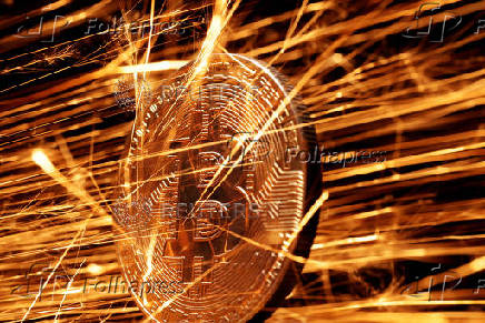 FILE PHOTO: Illustration shows sparks strike representation of cryptocurrency Bitcoin