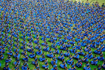 Participants wearing colourful attire, perform Bharatanatyam dance at the Jawaharlal Nehru International Stadium, in Kochi