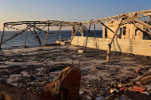 Al Deira hotel stands badly damaged, in Gaza City