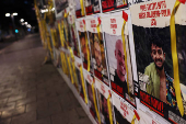 A view of a banner depicting Hersh Goldberg-Polin, an Israeli-American seized during the October 7 attack, in Tel Aviv