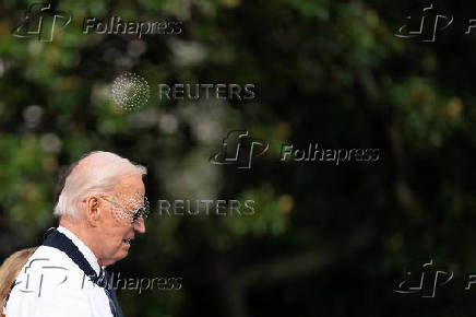 U.S. President Joe Biden wears the team USA Olympics jacket as he departs from the South Lawn of the White House