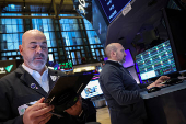 Traders work on the floor of the NYSE in New York