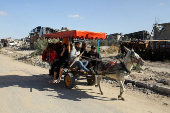 Palestinians flee the northern part of Gaza, amid an Israeli military operation, in Jabalia in the northern Gaza Strip