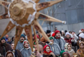 People dressed in traditional Ukrainian costumes attend a Christmas celebration in Lviv