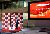 Akiyoshi Yamamura, President of Tokyo Metro poses before ringing a bell at a ceremony to  mark the company's debut on the Tokyo Stock Exchange in Tokyo