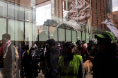 Protest in front of the residence of the University of Michigan's president, in Ann Arbor