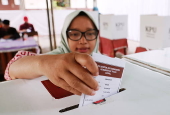 Voters cast their ballows in regional government elections in Indonesia