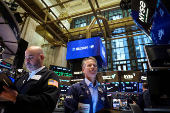 Traders work on the floor of the NYSE in New York