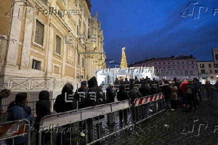 People walk through the Holy Door at Rome's Basilica of Saint Mary Major