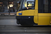 A tram with a European Union flag drives in Warsaw