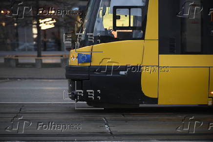 A tram with a European Union flag drives in Warsaw