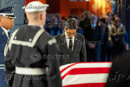 South Korean Consul General to Atlanta Sangpyo Suh, attends to view the casket of former President Jimmy Carter as he lies in repose at the Jimmy Carter Presidential Library and Museum in Atlanta