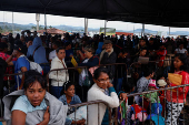 Venezuelans queue to get documentation after leaving Venezuela, at the border, in Pacaraima