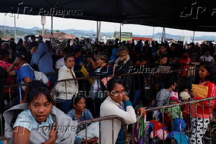 Venezuelans queue to get documentation after leaving Venezuela, at the border, in Pacaraima