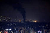 Smoke billows over Beirut's southern suburbs, as seen from Sin El Fil