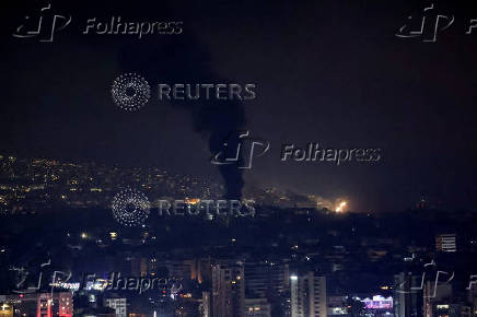 Smoke billows over Beirut's southern suburbs, as seen from Sin El Fil