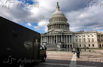 Police vehicles are parked outside the US Capitol building in Washington