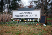 People pay tribute to former U.S. President Jimmy Carter who passed away at the age of 100