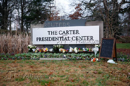 People pay tribute to former U.S. President Jimmy Carter who passed away at the age of 100