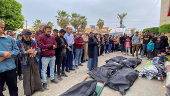 People mourn Gazans killed in an Israeli strike, in Deir Al-Balah in the central Gaza Strip