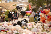 Floral tributes are left for victims of the attack at Westfield Bondi Junction shopping centre in Sydney