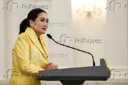 Thailand's Prime Minister Paetongtarn Shinawatra and her cabinet members attend a press conference in Bangkok