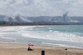 Smoke billows over southern Lebanon following Israeli strikes, as seen from Tyre, southern Lebanon