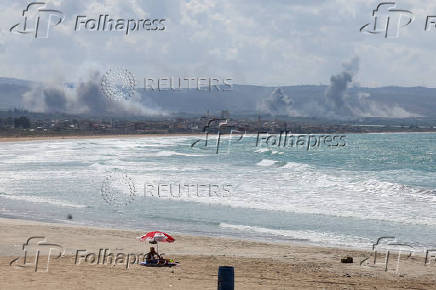 Smoke billows over southern Lebanon following Israeli strikes, as seen from Tyre, southern Lebanon