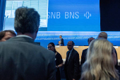 Shareholders arrive for the annual general meeting of the SNB in Bern