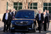 Former U.S. President Carter's casket travels to Atlanta, Georgia