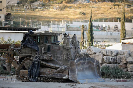 An army excavator is pictured in Tulkarm