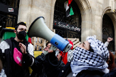 Masked youths take part in a protest in support of Palestinians in Gaza, in Paris