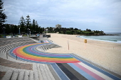 Tar balls washed ashore forces closure of Coogee Beach