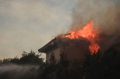 Smoke billows from the Mountain Fire, in California